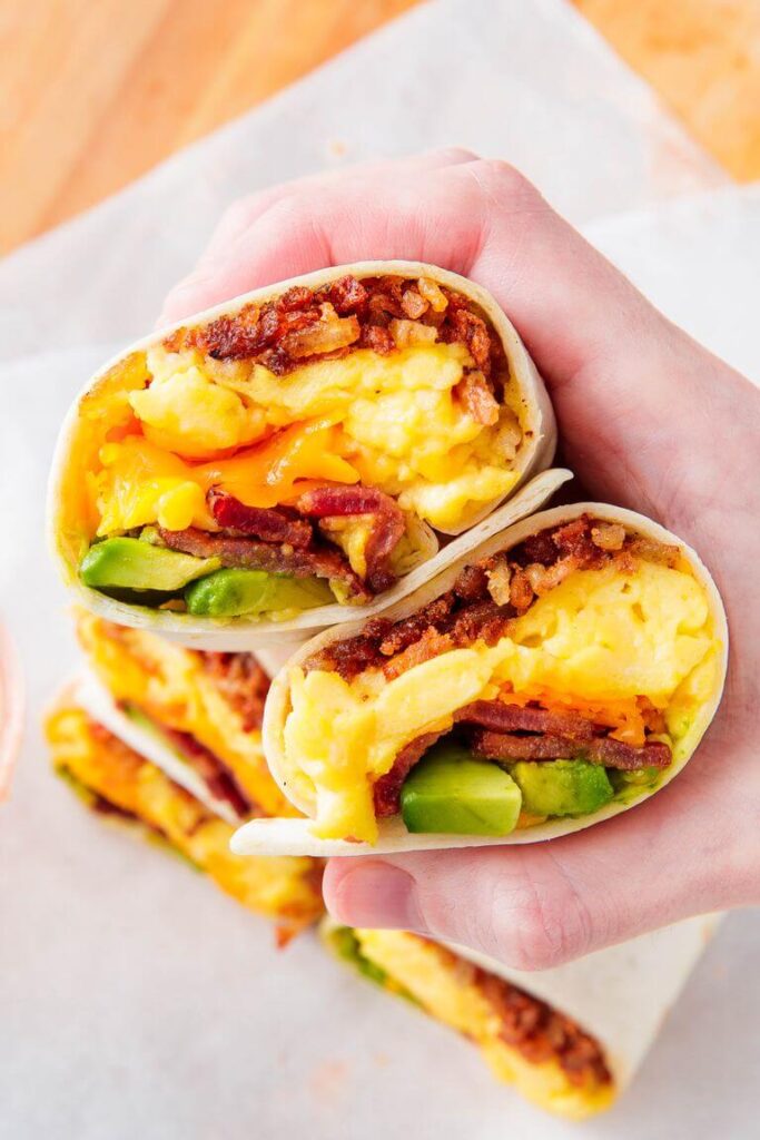 Cheesy Bacon Breakfast Burrito. Quick and healthy breakfast recipes - easy and incredibly delicious meals for busy mornings! Find easy to cook omelette, cheesy burrito, breakfast sandwiches, some sweets like smoothies, parfaits, pancakes, and more!