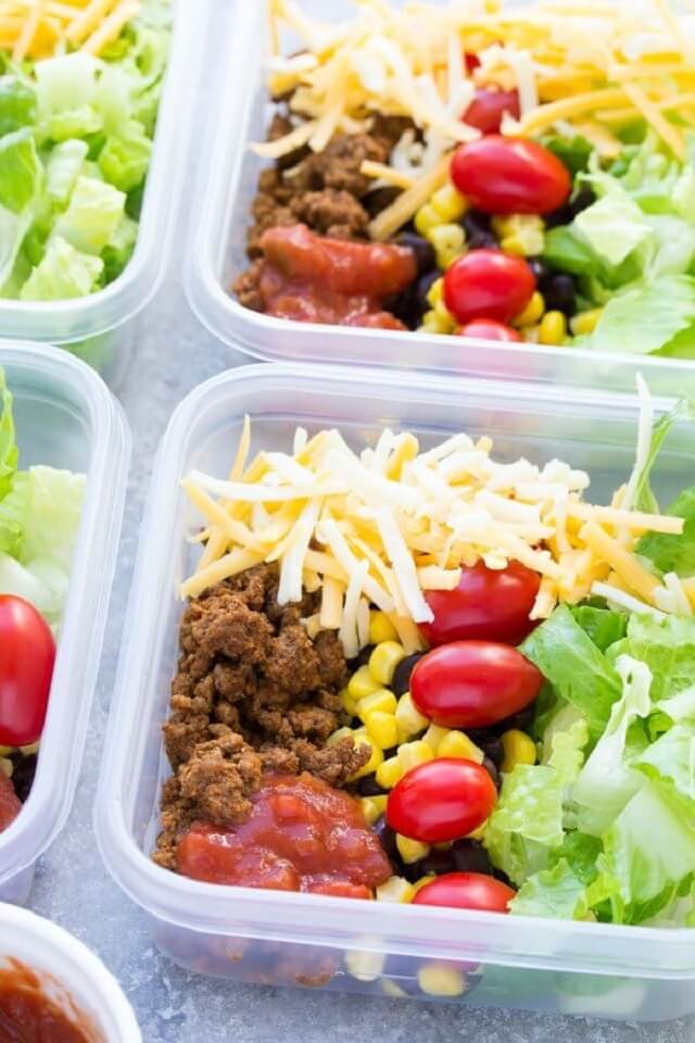Taco meat, lettuce, cheese, black beans, corn, and salsa make up these quick taco salads.