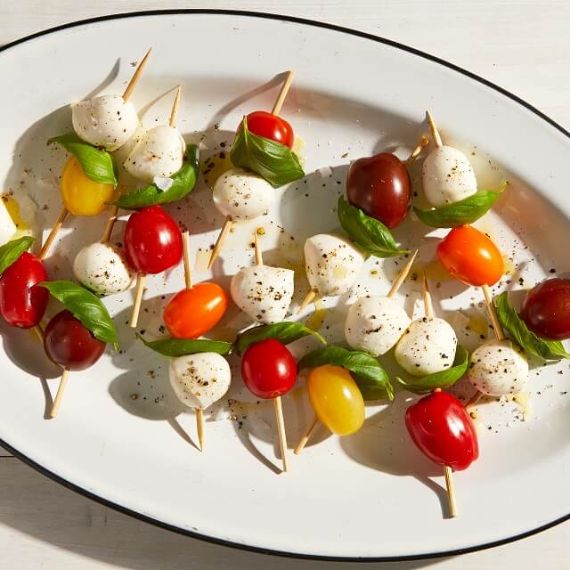These delectable 4th of July appetizers are ideal while you wait for the grilling to begin! From pinwheels and skewers to salads and something sweet, there's something for you here that you'll definitely enjoy!