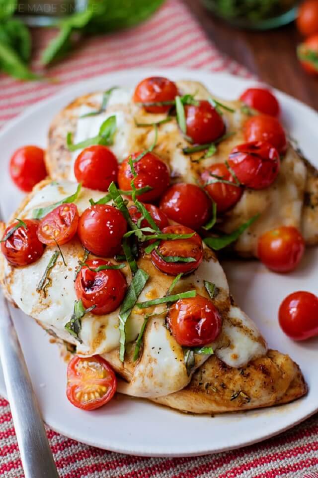 Three chicken breasts, an oven-safe skillet, a few seasonings, some mozzarella, tomatoes, basil, and balsamic vinegar are all that are required to make this recipe.